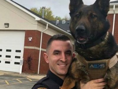 HE HELD HIS K9 PARTNER WITH A SMILE—BUT THE STORY BEHIND THIS PHOTO WILL BREAK YOU