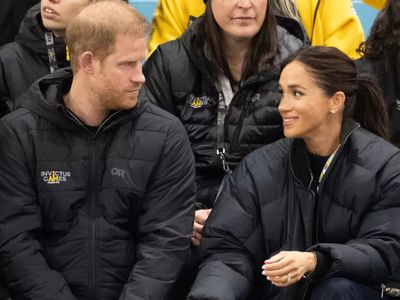 Lip reader 'reveals' what Meghan Markle actually said to Prince Harry during PDA moment at latest appearance