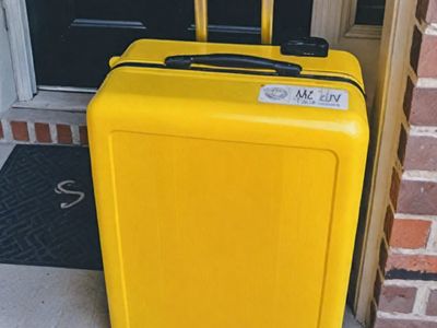 I Returned Home to Find a Big Yellow Suitcase on My Doorstep with a Note – When I Opened It, I Went Pale