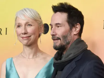 Keanu Reeves’ girlfriend, 54, faces mixed reactions after posing in teal cut-out dress on red carpet